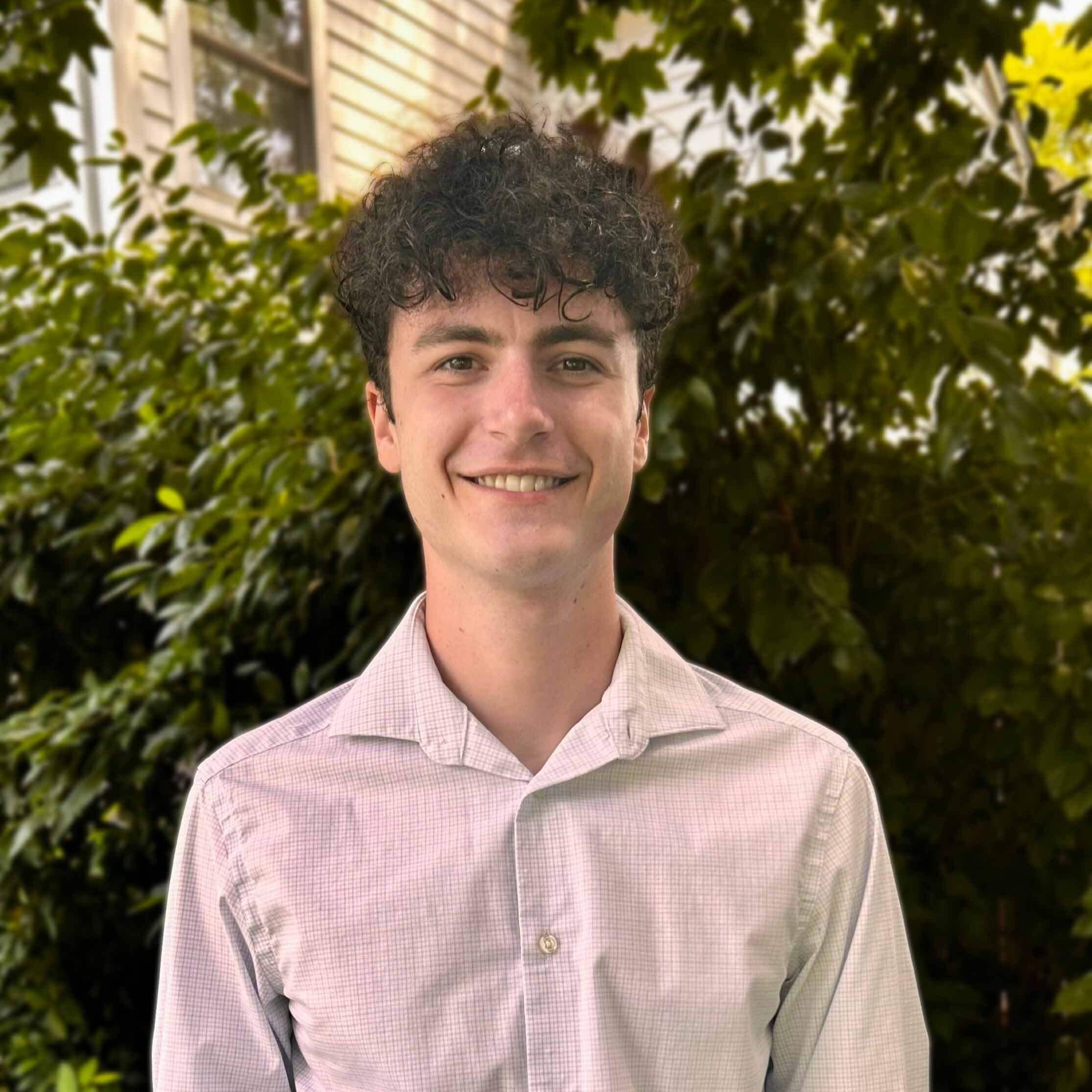 headshot of Simon Okun, membership and communications coordinator